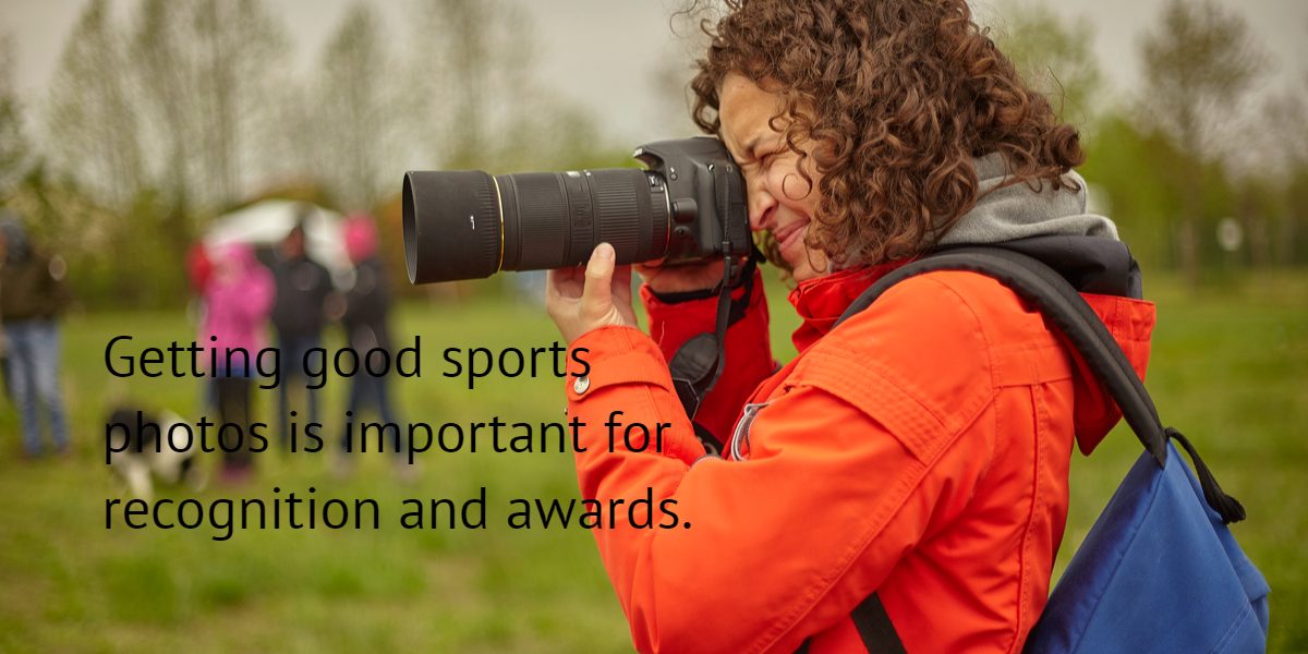 an amateur photographer takes photos at a sporting event.